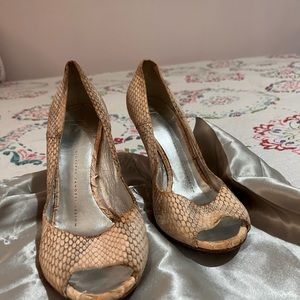 Giuseppe zanotti design snake skin texture and silver heel.